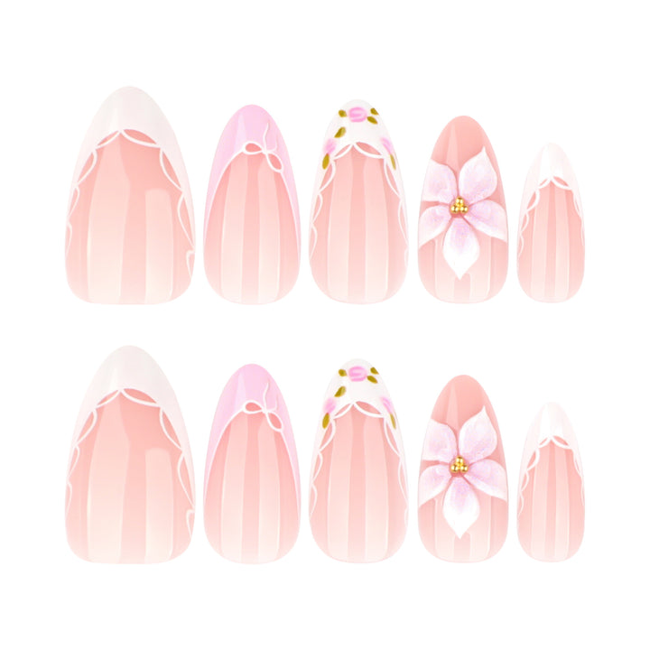 Artful nail extensions with delicate floral pattern and elegant accents Stornfield