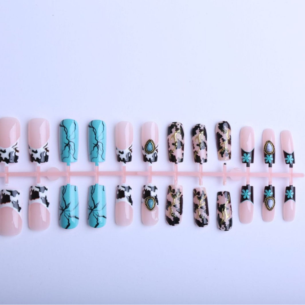 Artful fingernails with unique marble and jewelry design Stornfield