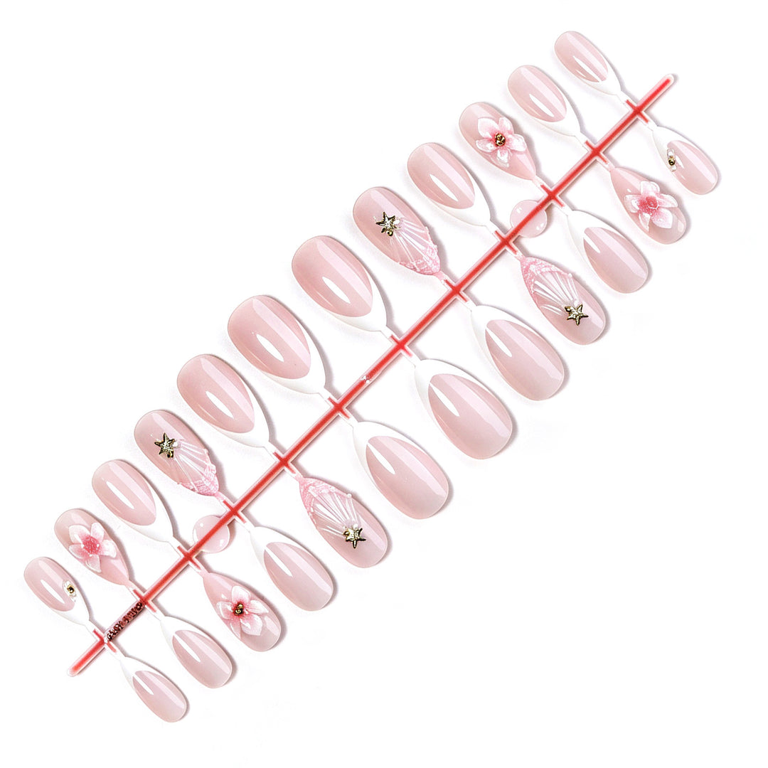 Artificial nail set with delicate flower and glitter applications Stornfield