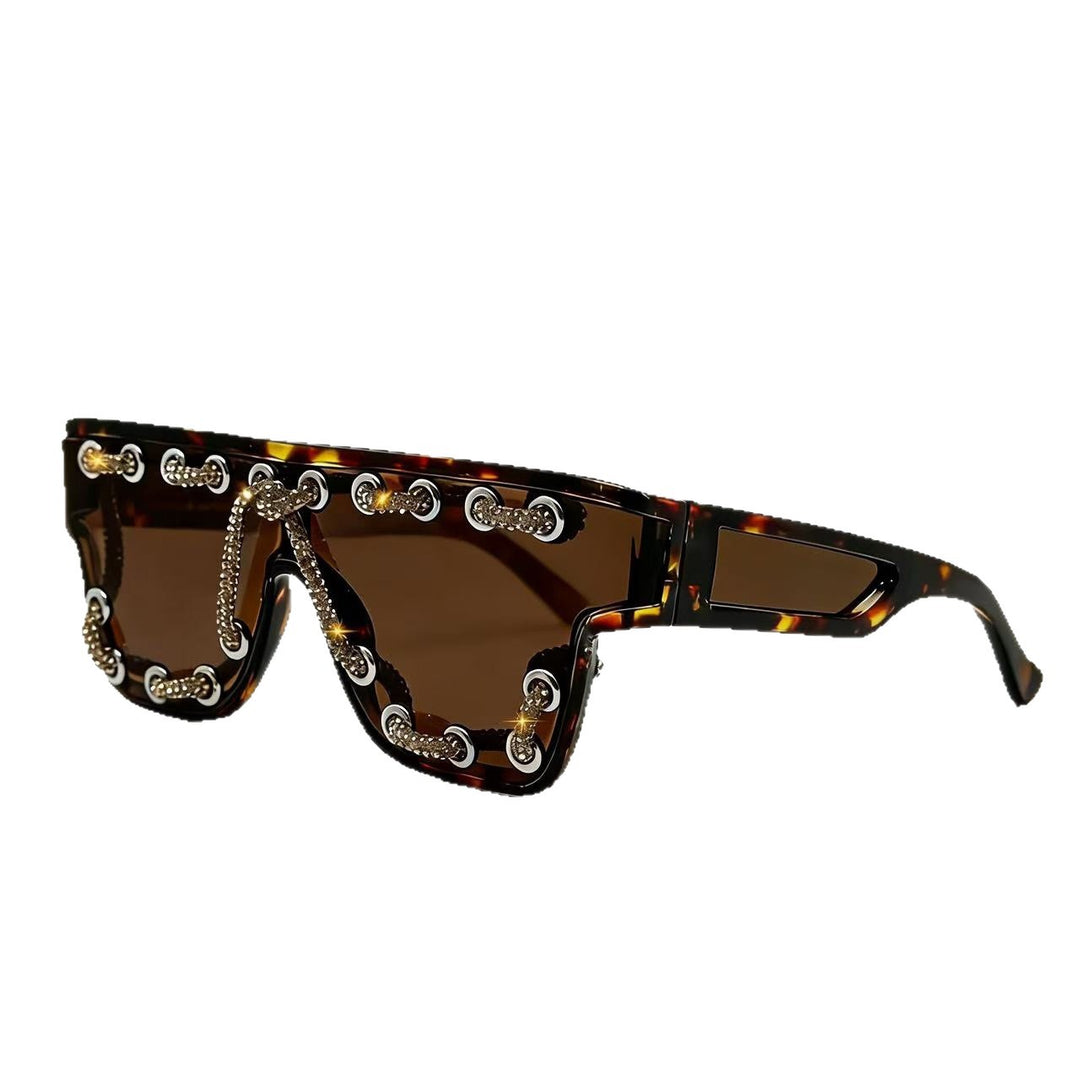 Ladies sunglasses with extravagant design and decorative chain embellishment Stornfield