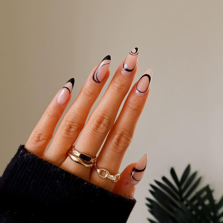 Artful stiletto nails with geometric accents Stornfield