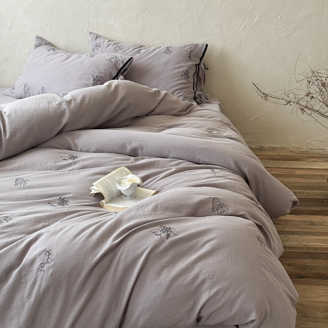 Breathable cotton-linen bedding set with delicate floral embroidery and bow closure
