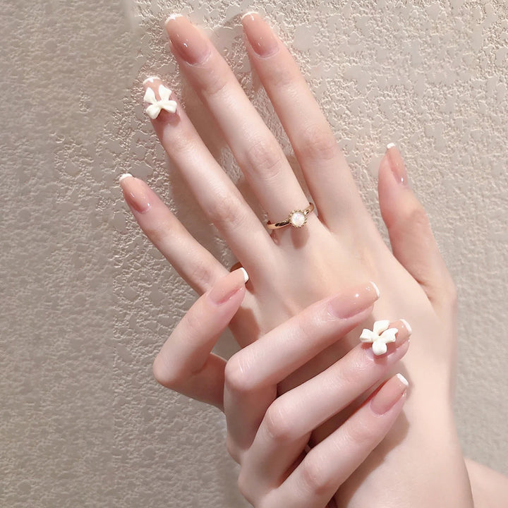Artificial nails with heart accent and glamorous decorations Stornfield