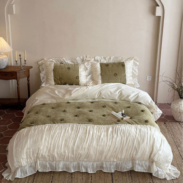 Satin look quilted bedspread with pleated ruffle and 3D flower appliqué