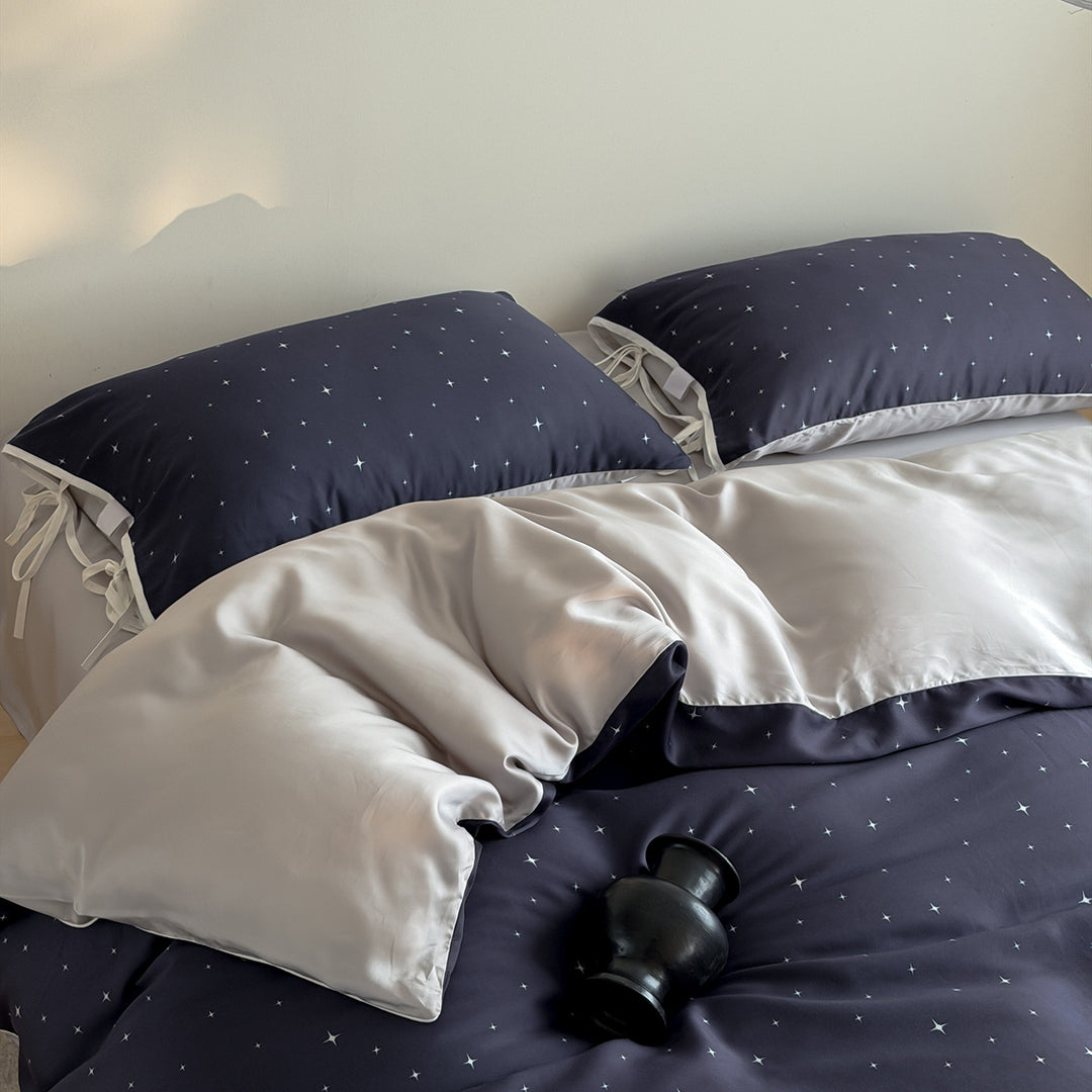 Bedding set with fine star pattern and pillow tie ribbons