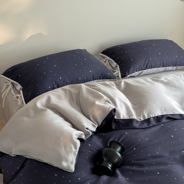 Bedding set with fine star pattern and pillow tie ribbons
