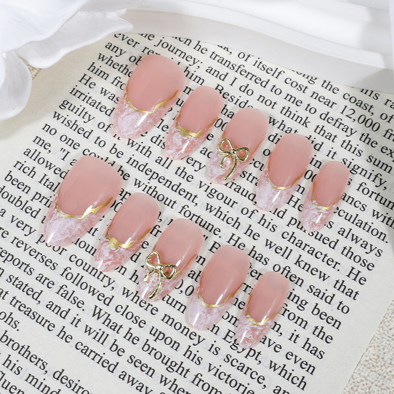 Acrylic nail set with elegant tips and delicate embellishments Stornfield