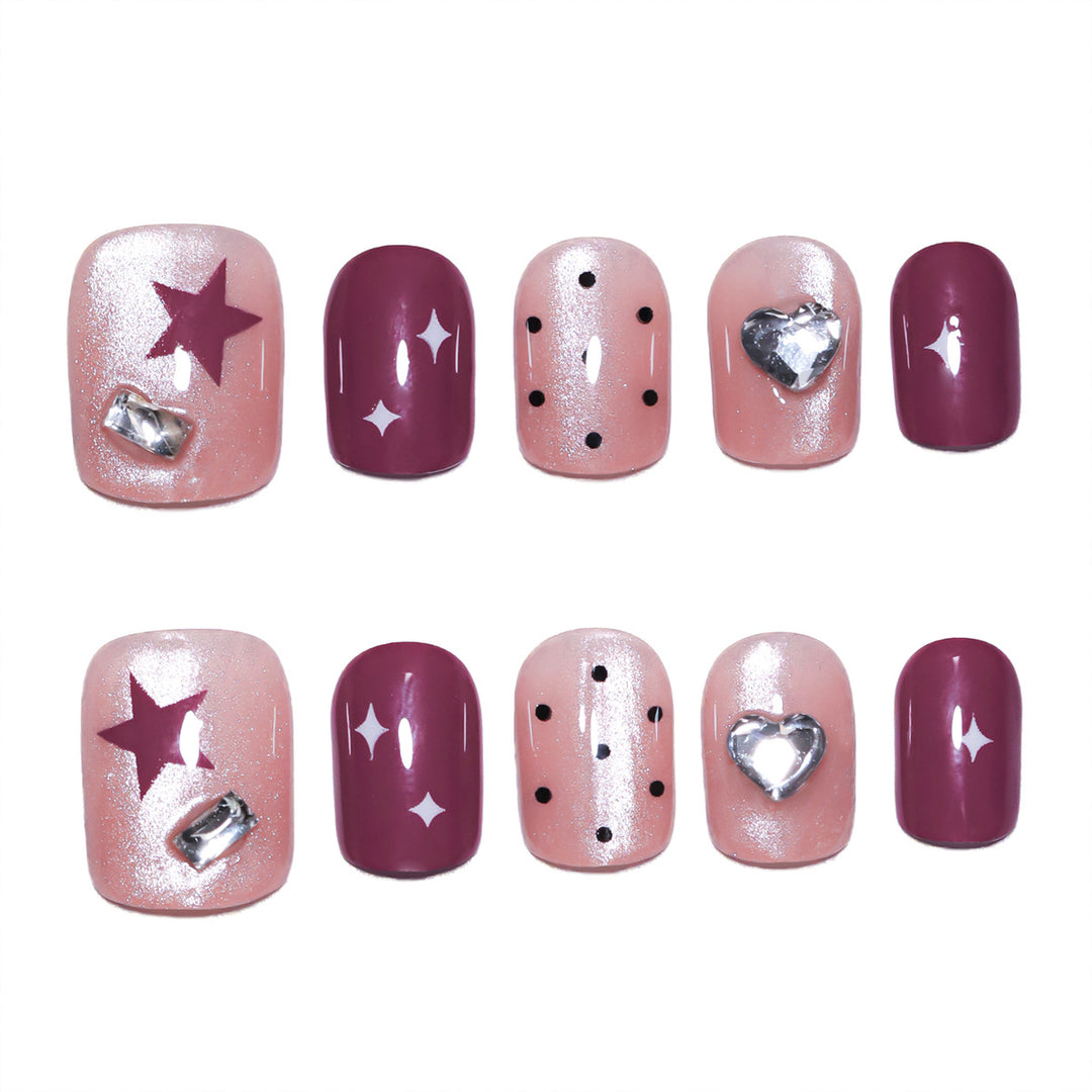 Artificial nail extensions with unique jewelry accents Stornfield