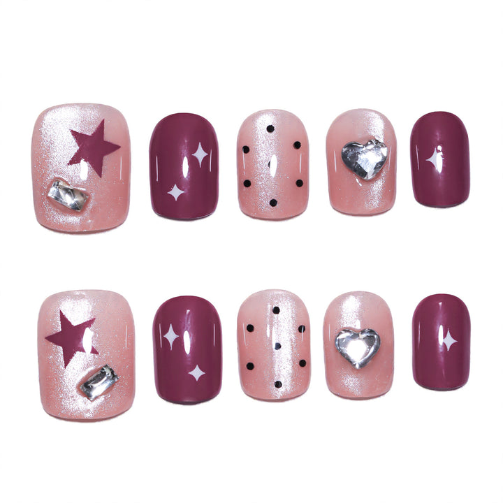 Artificial nail extensions with unique jewelry accents Stornfield