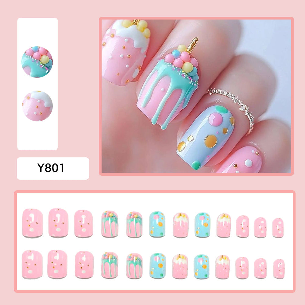 Artificial nails with playful cupcake design Stornfield