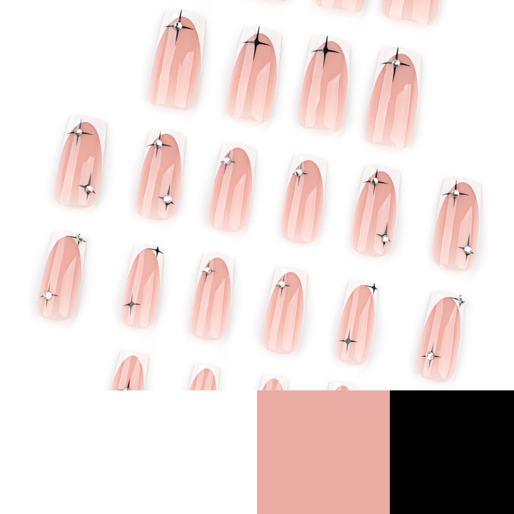 Artificial nail extensions with elegant French tip and glitter accents Stornfield