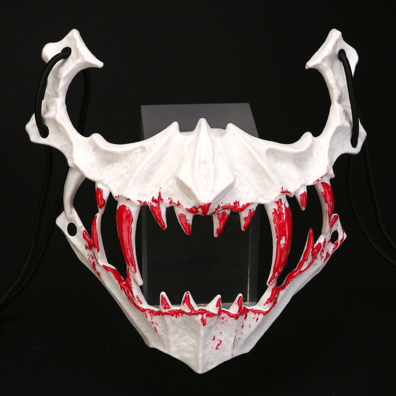 Half-face mask with flashing vampire teeth and adjustable rubber band