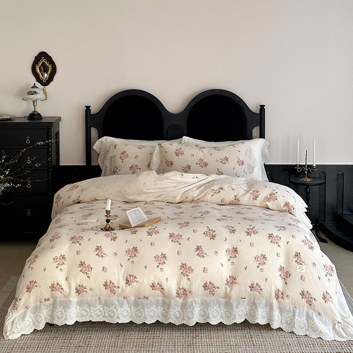 Cotton muslin bedding set with ruffles, lace trim, and delicate bow print