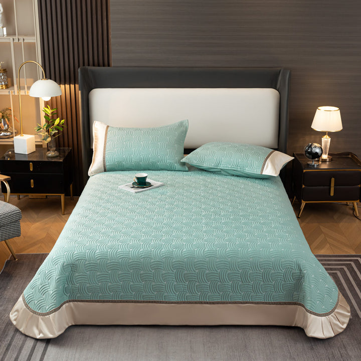 Quilted bedspread set with satin ruffle and geometric wave relief
