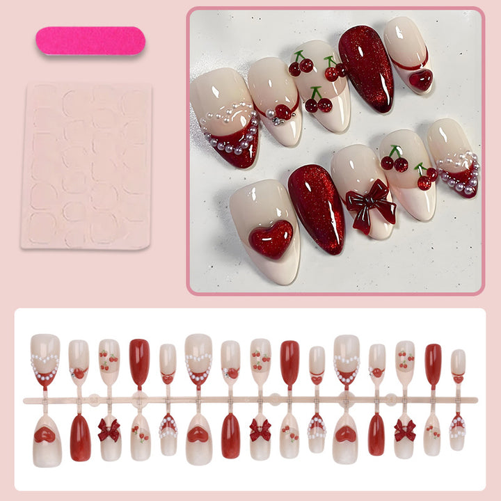 Artificial nail set with romantic berry designs and glamorous embellishments Stornfield