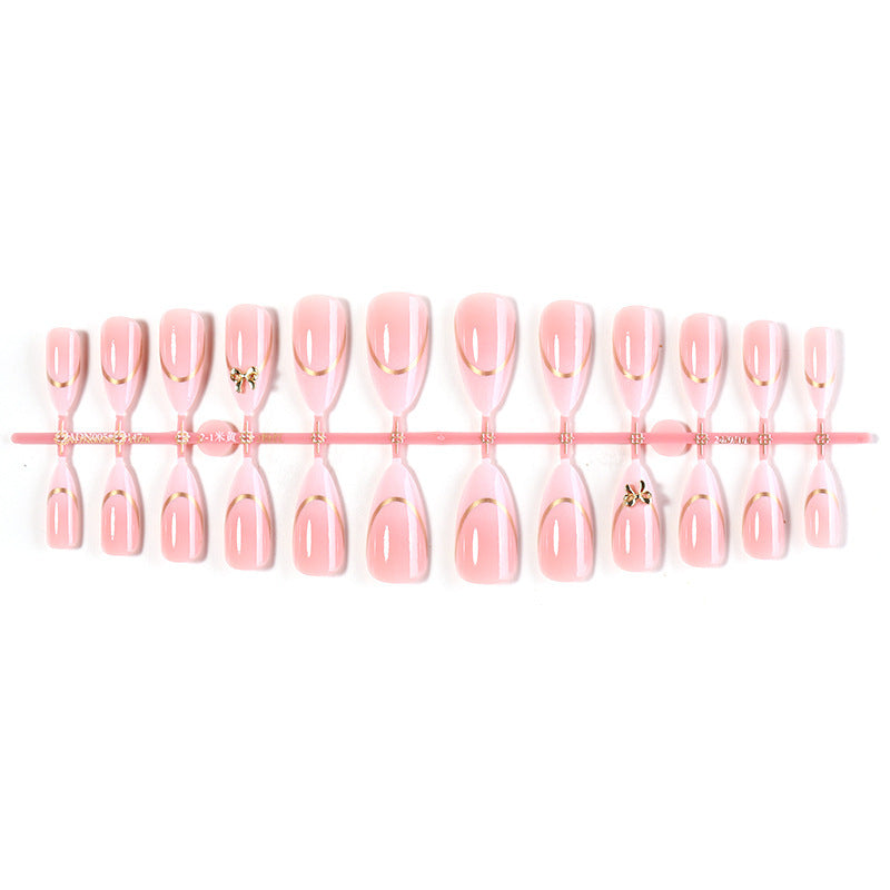 Artificial nail set with elegant gold edge and decorative accents Stornfield