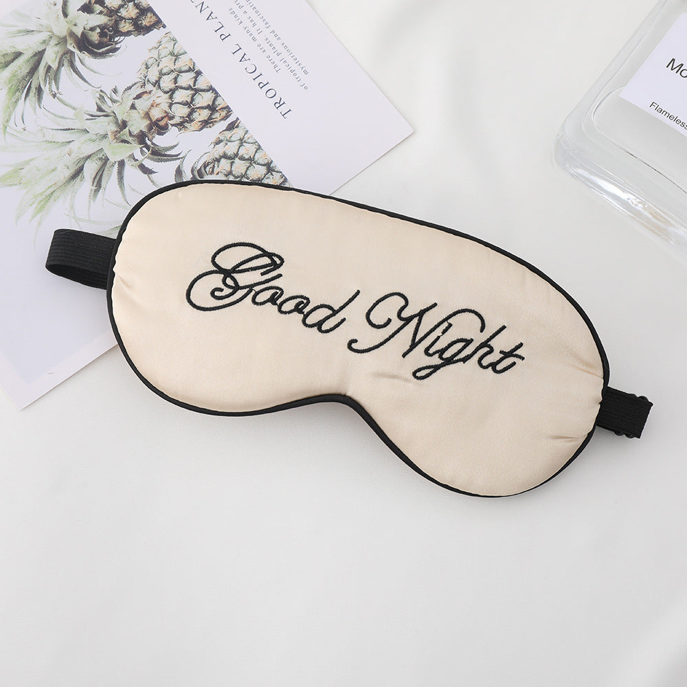 Unisex embroidered contoured sleep mask with decorative text embroidery and adjustable elastic band Stornfield