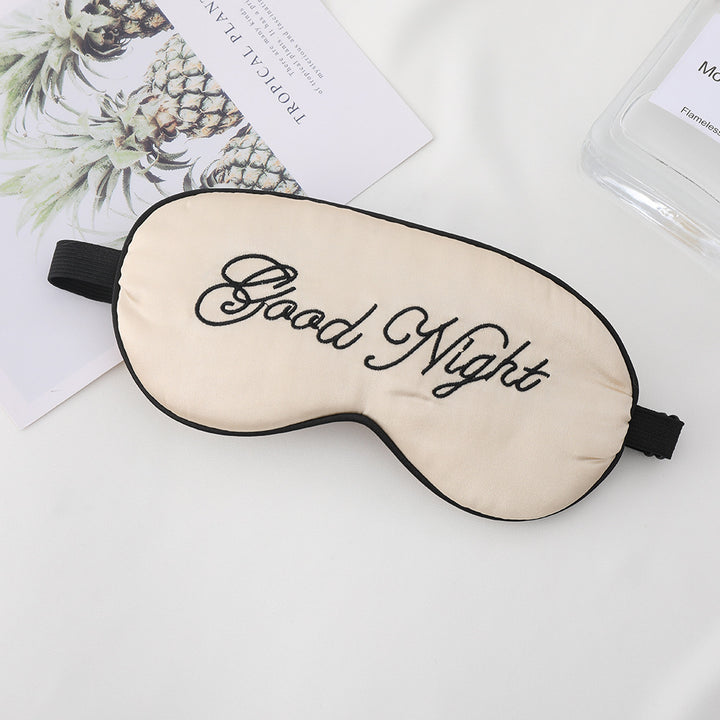 Unisex embroidered contoured sleep mask with decorative text embroidery and adjustable elastic band Stornfield