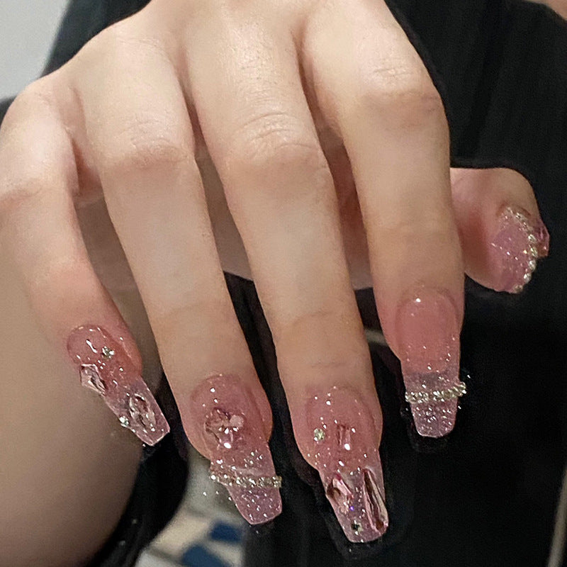 Artificial nails with heart design and glitter accents Stornfield