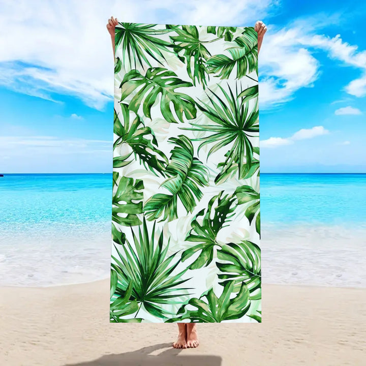 Beach towel with tropical palm leaf pattern Stornfield