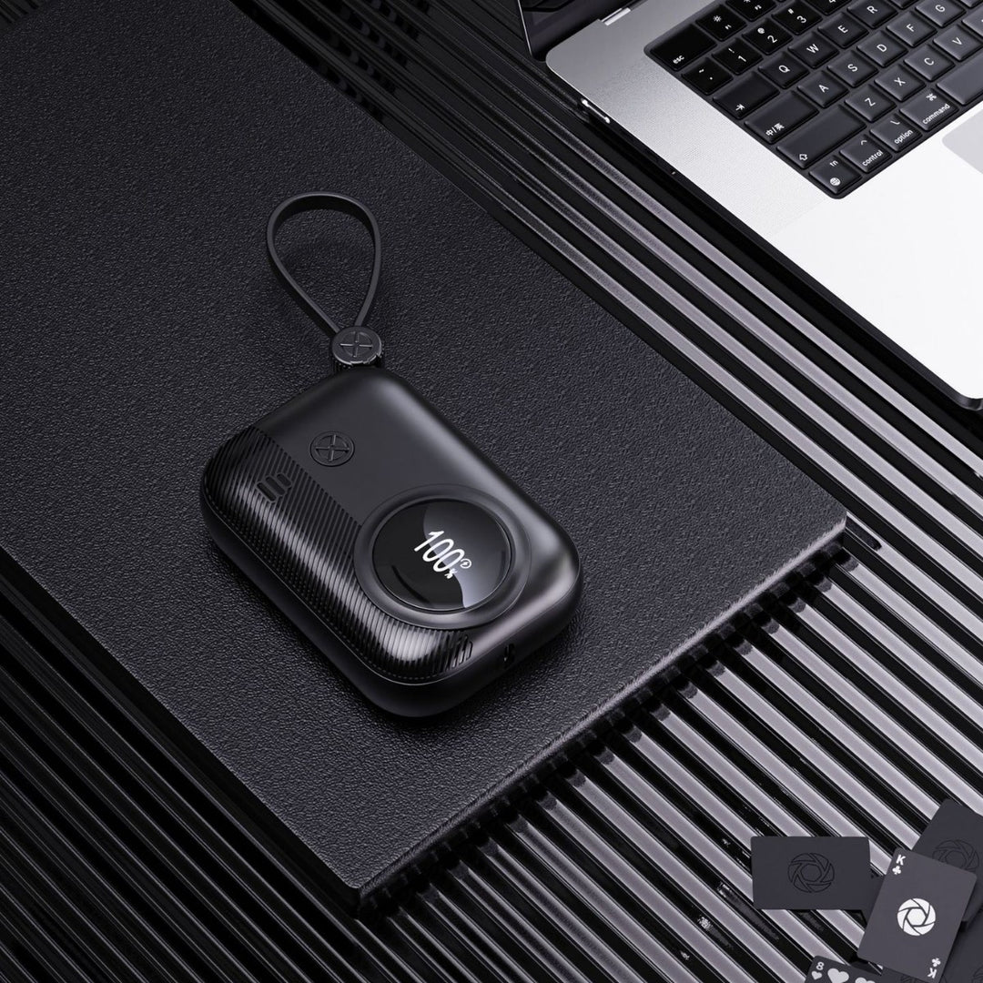 Compact power bank with integrated charging plug and digital humidity indicator Stornfield