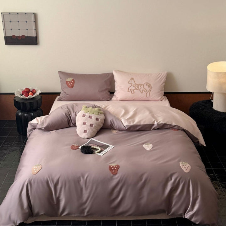 Bedding set with embroidered strawberry appliqués and silky matte satin look