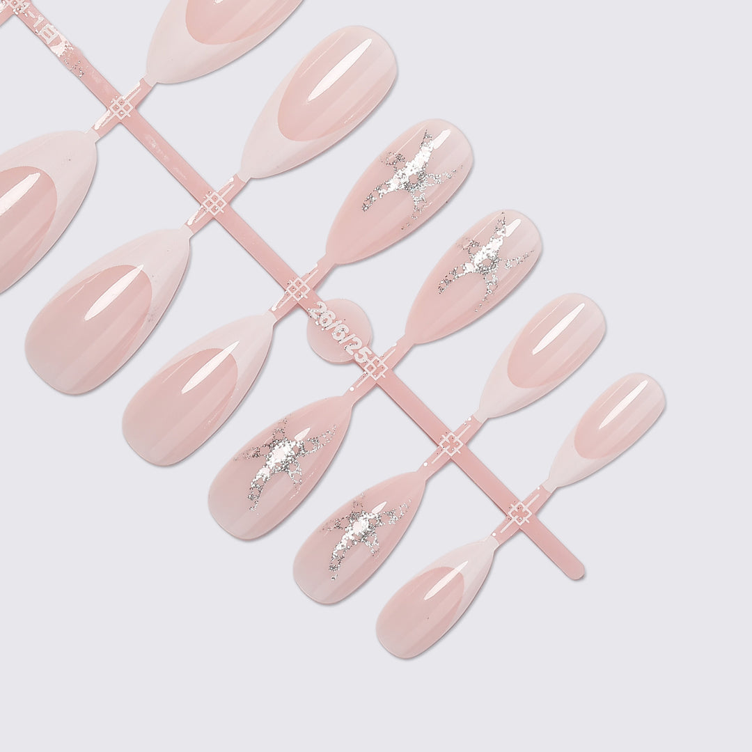 Artificial nail set with delicate pearlescent and glitter accents Stornfield