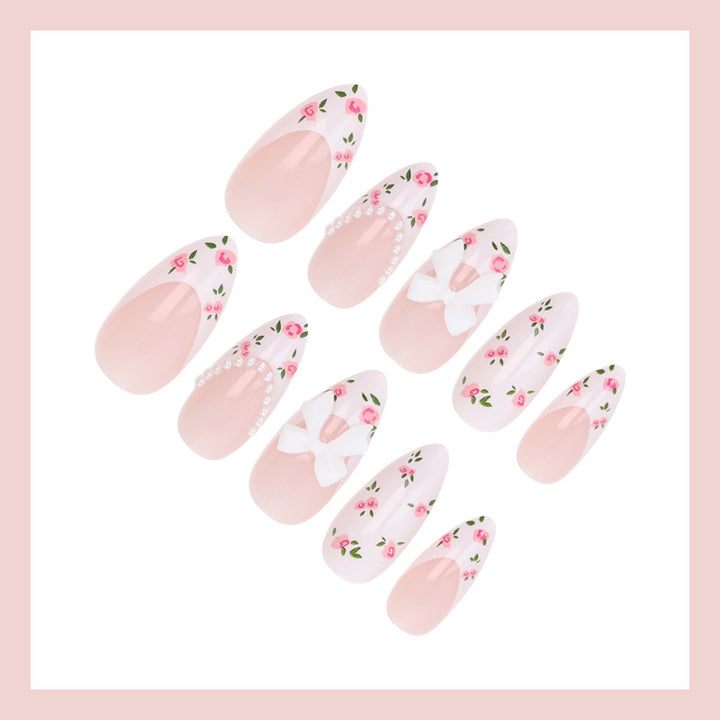 Artificial nail set with romantic flower motifs and elegant details Stornfield