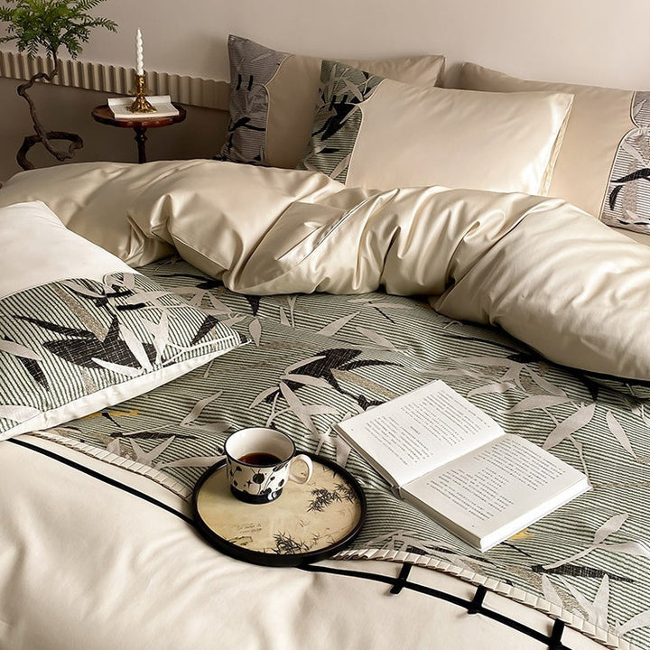 Reversible satin bedding set with quilted décor and botanical bamboo print