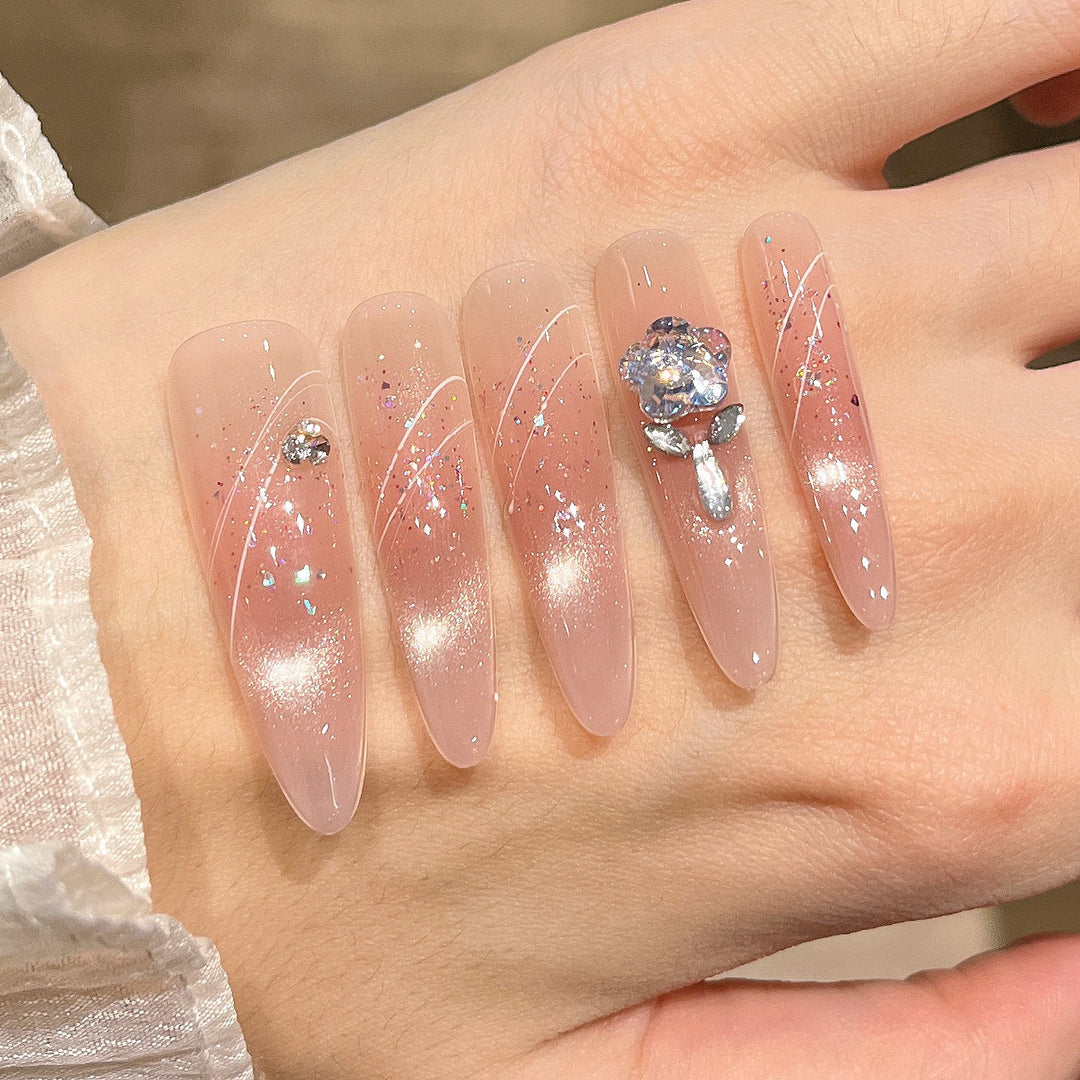 Artistic Stiletto Press-On Nail Art with Glimmering Accents Stornfield