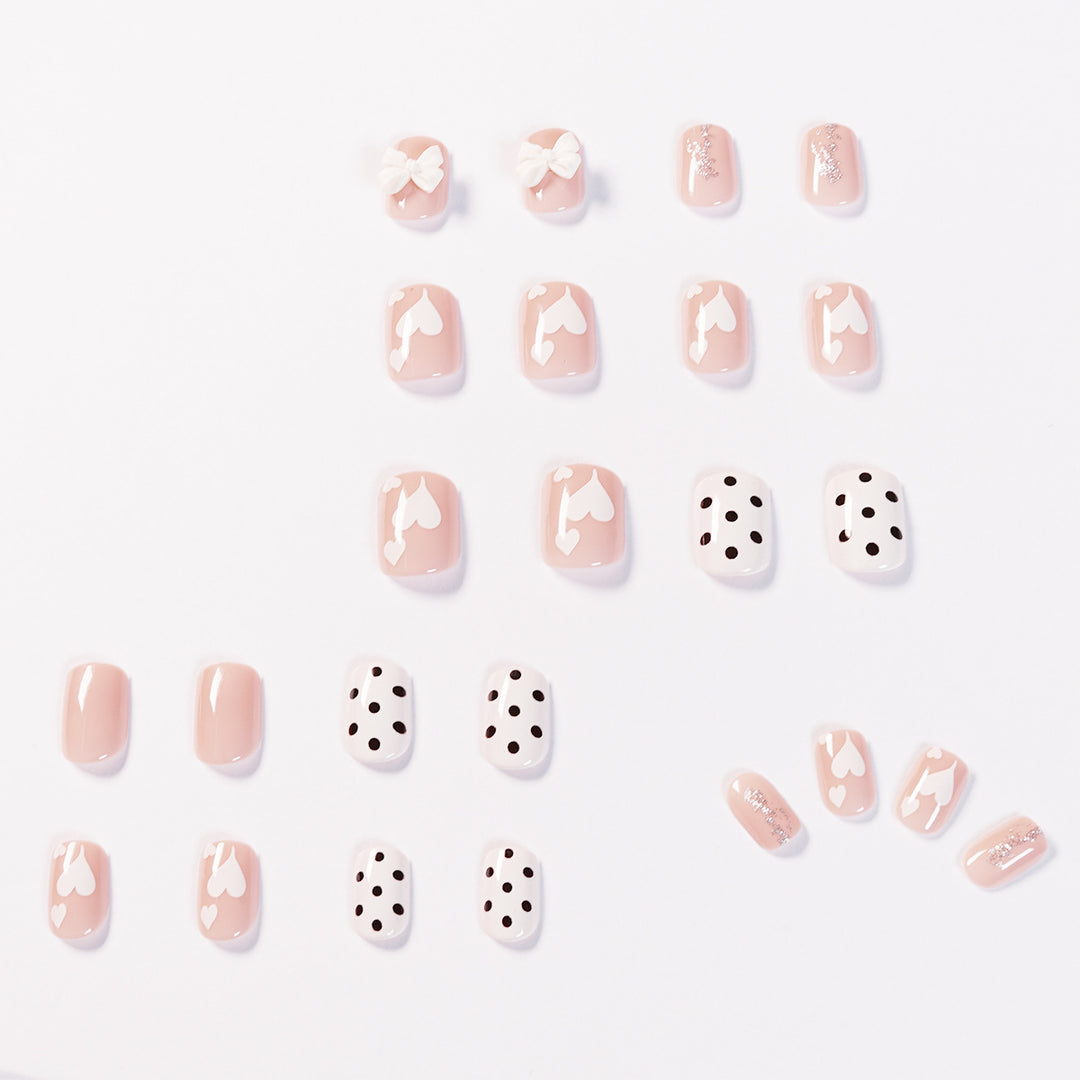Artful nail art with delicate flower and heart motifs Stornfield