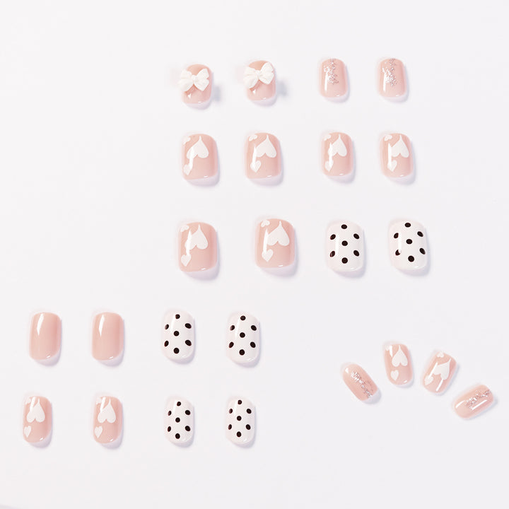 Artful nail art with delicate flower and heart motifs Stornfield