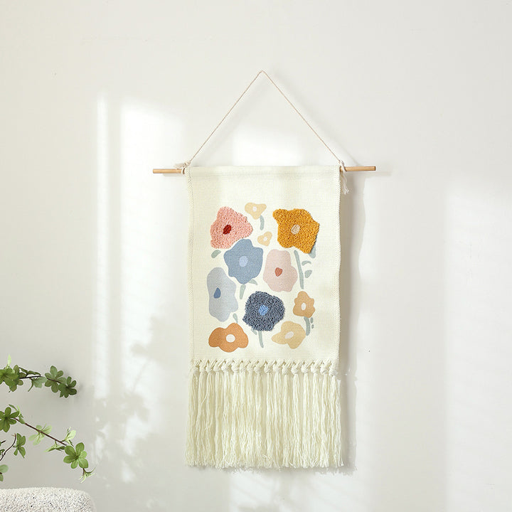 Woven cotton wall hanging with punch needle flower relief and fringes Stornfield