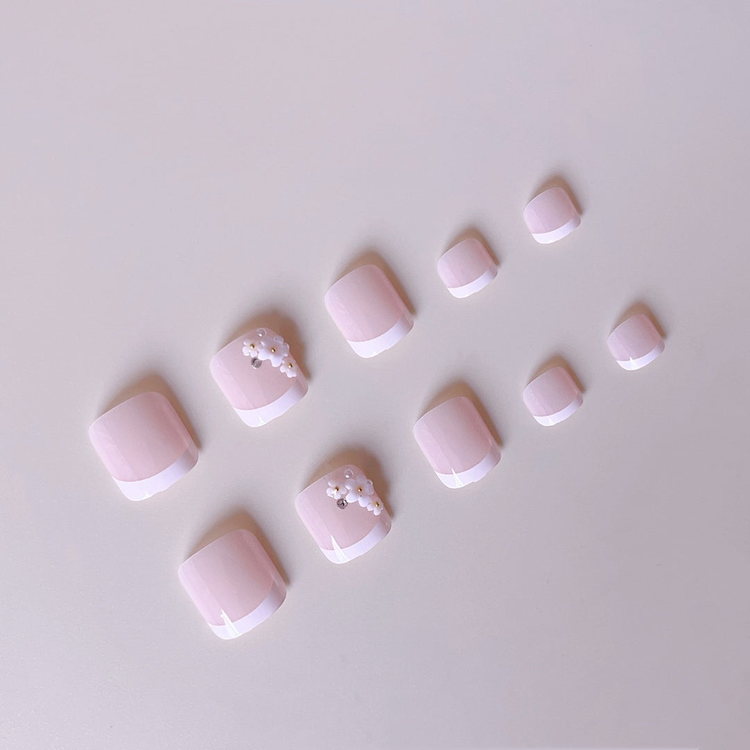 Elegant toenail art with delicate 3D floral decorations Stornfield