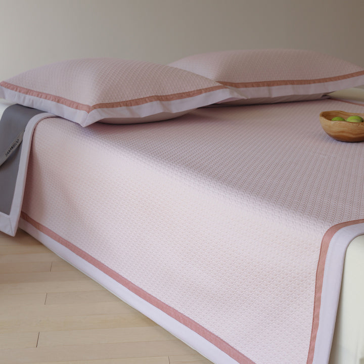 Quilted bedspread with textured waffle pattern and pillowcases