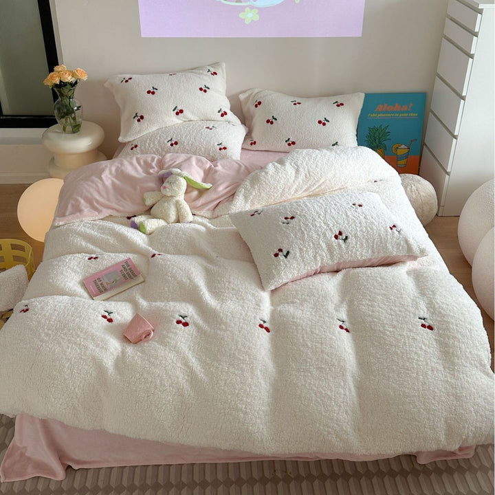 Cozy Sherpa blanket with embroidered teddy and cake motifs