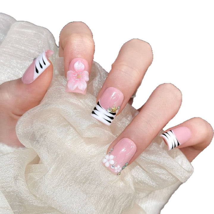 Artistic Press-On Nail Enhancements with Pattern and Gem Accents
