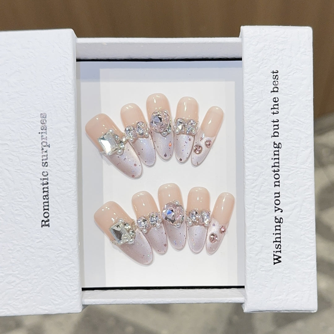 Romantic artificial nails with glitter decoration Stornfield