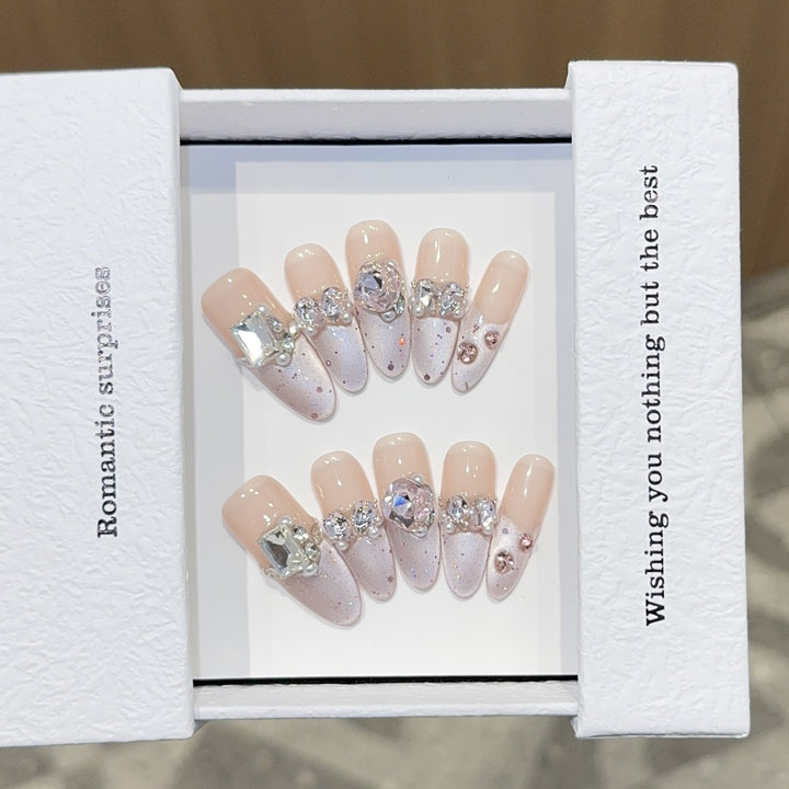 Romantic artificial nails with glitter decoration Stornfield
