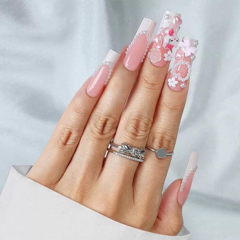 Acrylic nail set with playful 3D accents and pearl details Stornfield