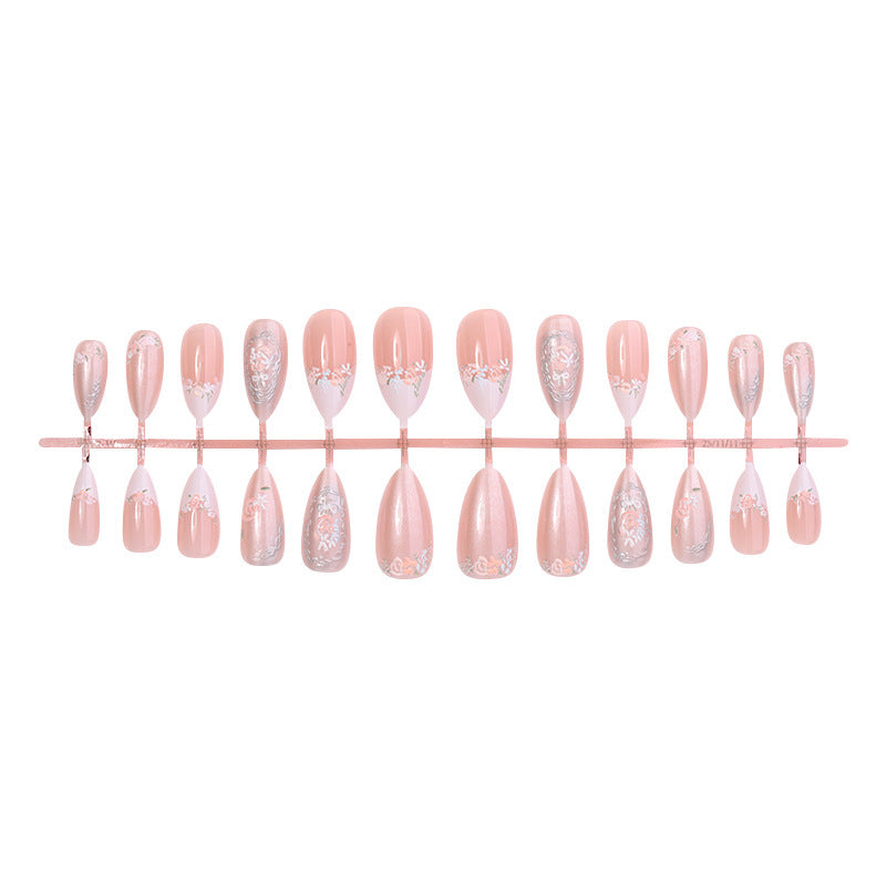 Acrylic nail set with elegant floral and glitter motifs Stornfield