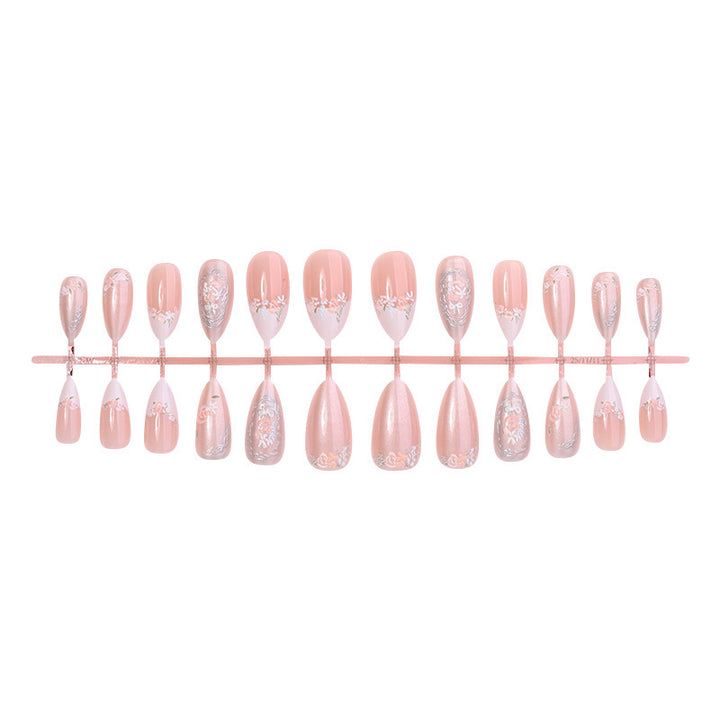 Acrylic nail set with elegant floral and glitter motifs Stornfield