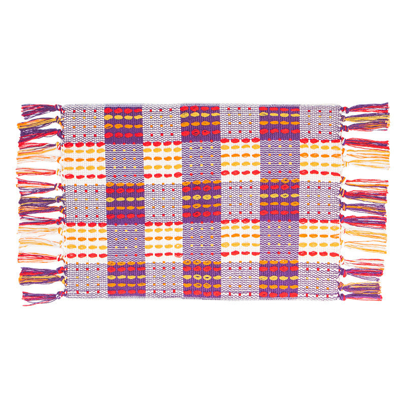 Woven colorful table runner with fringes and checkered structure