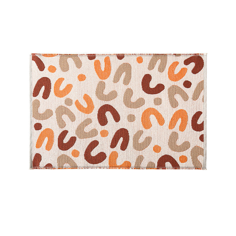 Flat-woven living room rug in a graphic tile pattern