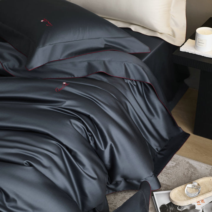 Bedding set made of fine satin with a silky-smooth finish and embroidered logo