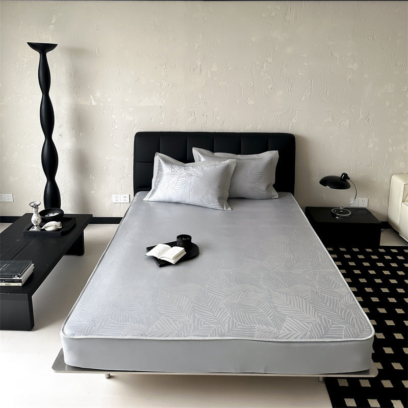 high-quality non-slip mattress protector with integrated fitted sheet and elegant jacquard pattern