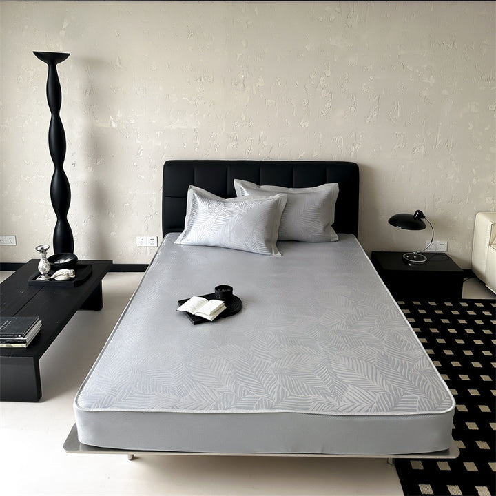 high-quality non-slip mattress protector with integrated fitted sheet and elegant jacquard pattern