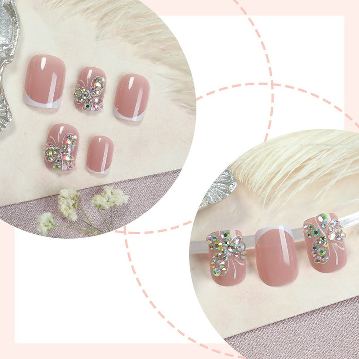 Artifical nail set with sparkling accents and elegant bows Stornfield