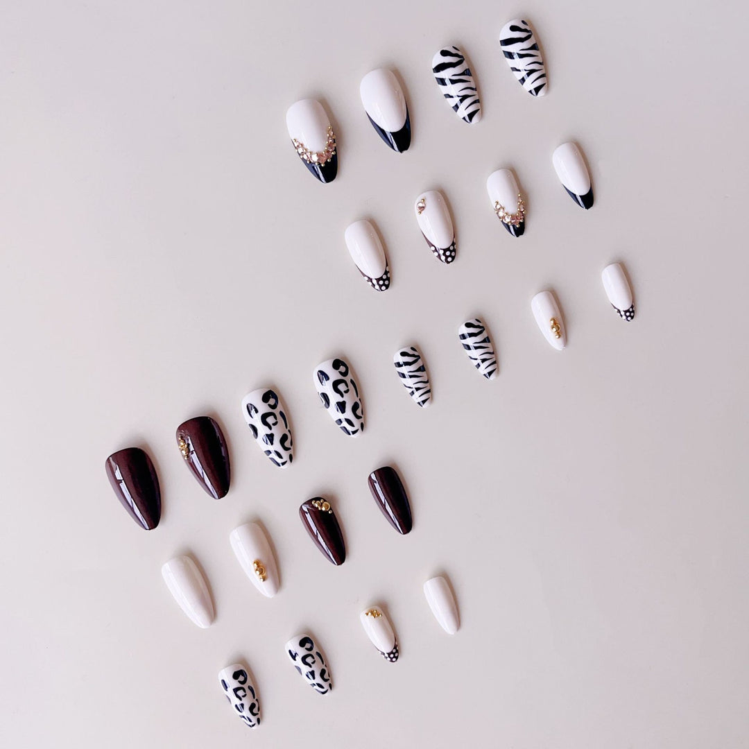 Acrylic nail set with luxurious animal motif designs and glamorous accents Stornfield