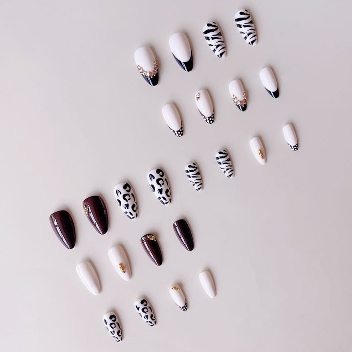Acrylic nail set with luxurious animal motif designs and glamorous accents Stornfield